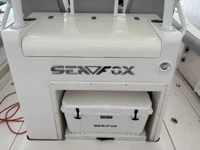 Slide: The Image of 2023 Sea Fox 328 Commander boat interior with branded cooler storage. - 12