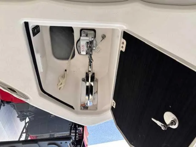Slide: The Image of 2023 Sea Fox 328 Commander anchor compartment with winch and chain storage. - 2