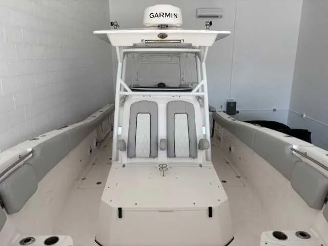 Slide: The Image of 2023 Sea Fox 328 Commander boat with Garmin equipment, featuring spacious seating and modern design. - 3