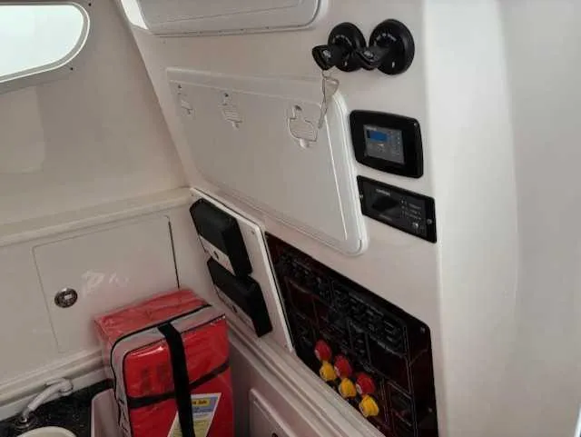 Slide: The Image of Interior view of 2023 Sea Fox 328 Commander boat with control panel and safety equipment. - 4