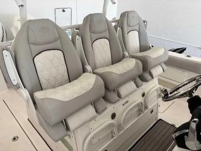 Slide: The Image of 2023 Sea Fox 328 Commander boat seats, featuring luxurious beige and white upholstery. - 9