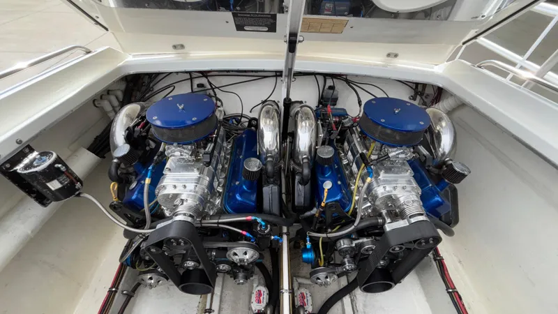 Slide: The Image of Twin engines in a 1993 Cigarette 38 Top Gun boat, showcasing powerful marine engineering. - 10
