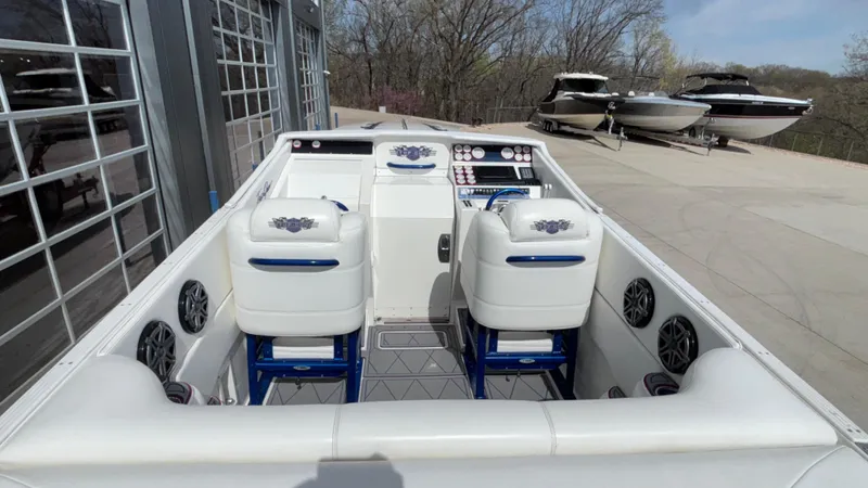 Slide: The Image of 1993 Cigarette 38 Top Gun boat interior with dual seats and control panel. - 13