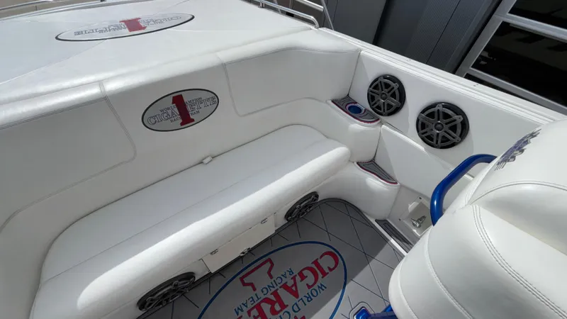 Slide: The Image of 1993 Cigarette 38 Top Gun boat interior with white seating and audio speakers. - 18