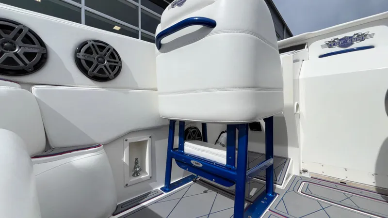 Slide: The Image of 1993 Cigarette 38 Top Gun boat interior with white seating and blue accents. - 21