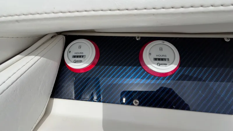 Slide: The Image of Dashboard of 1993 Cigarette 38 Top Gun boat with hour meters. - 24