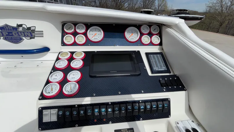 Slide: The Image of 1993 Cigarette 38 Top Gun dashboard with gauges and controls, featuring a sleek design. - 28