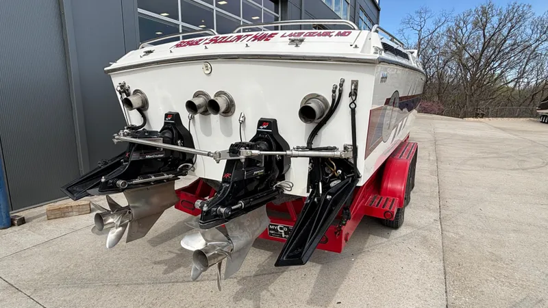 Slide: The Image of 1993 Cigarette 38 Top Gun boat with dual propellers on a red trailer. - 3