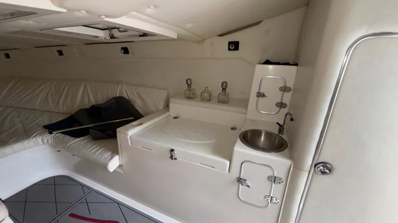 Slide: The Image of Interior of 1993 Cigarette 38 Top Gun boat with seating, sink, and storage. - 34