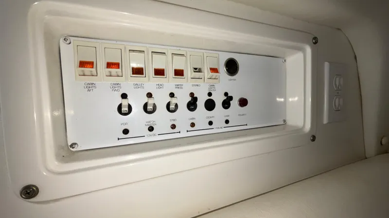 Slide: The Image of Control panel of a 1993 Cigarette 38 Top Gun boat with switches and dials. - 43