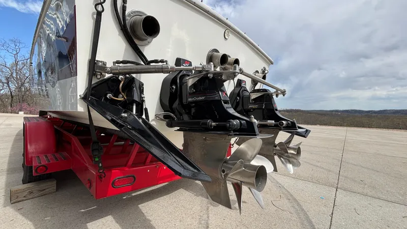 Slide: The Image of 1993 Cigarette 38 Top Gun boat on trailer, showing dual propellers and stern details. - 7