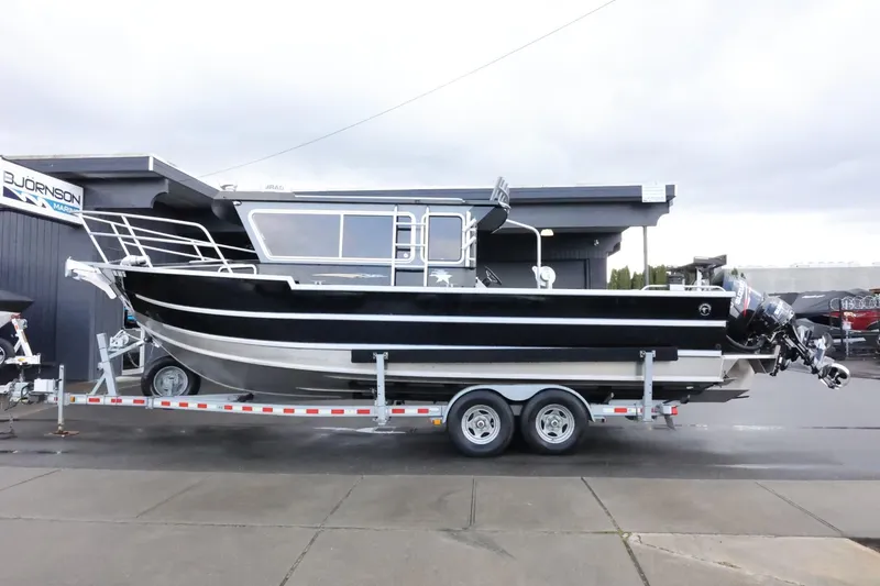 Slide: The Image of 2015 Duckworth 26 Offshore boat on trailer, parked outside dealership. - 1