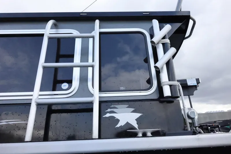 Slide: The Image of Duckworth 26 Offshore 2015 boat side view with ladder and rod holders. - 10