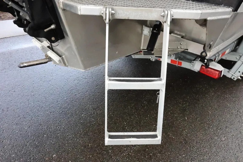 Slide: The Image of Aluminum ladder on a 2015 Duckworth 26 Offshore boat, shown on a wet surface. - 11