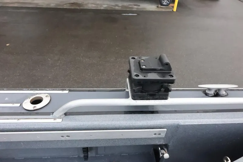 Slide: The Image of 2015 Duckworth 26 Offshore boat detail showing a mounting bracket and rod holder on deck. - 14