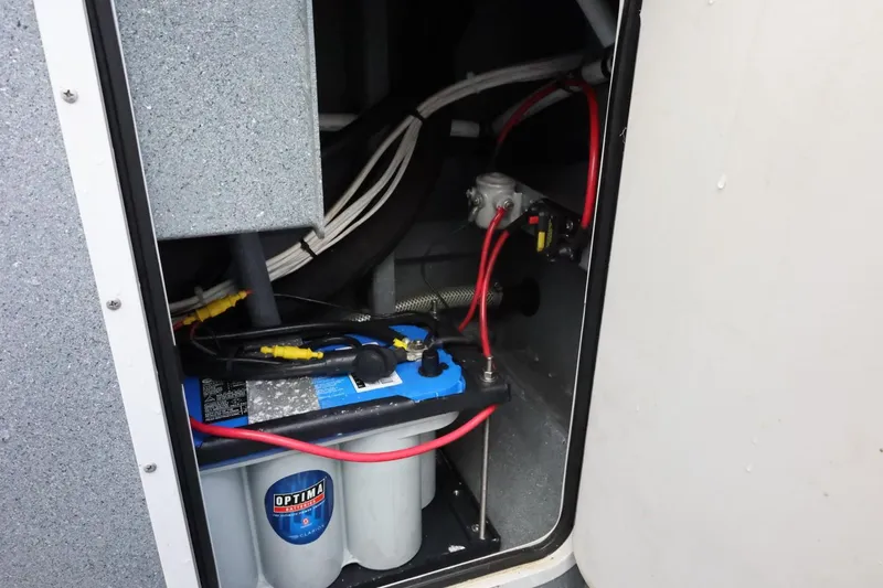 Slide: The Image of Battery compartment of a 2015 Duckworth 26 Offshore boat with Optima battery. - 19