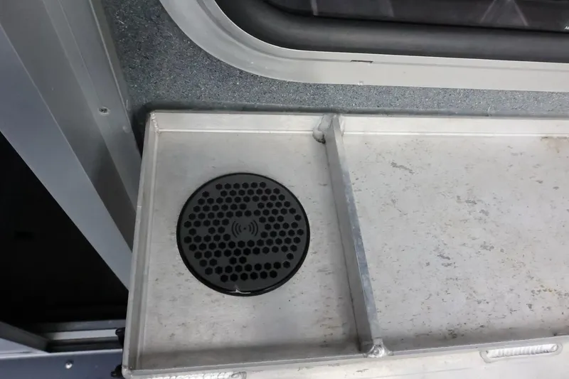 Slide: The Image of Interior detail of a 2015 Duckworth 26 Offshore boat, featuring a built-in speaker. - 25