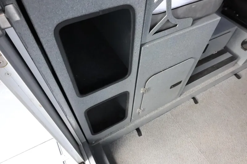 Slide: The Image of Interior storage compartments of a 2015 Duckworth 26 Offshore boat. - 27