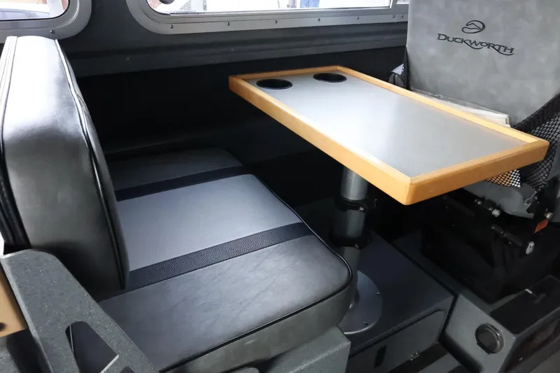 Slide: The Image of Interior of 2015 Duckworth 26 Offshore boat with seating and table. - 32
