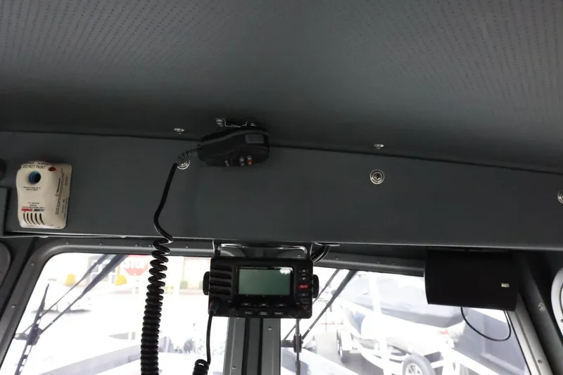 Slide: The Image of Interior of a 2015 Duckworth 26 Offshore boat with communication equipment. - 35