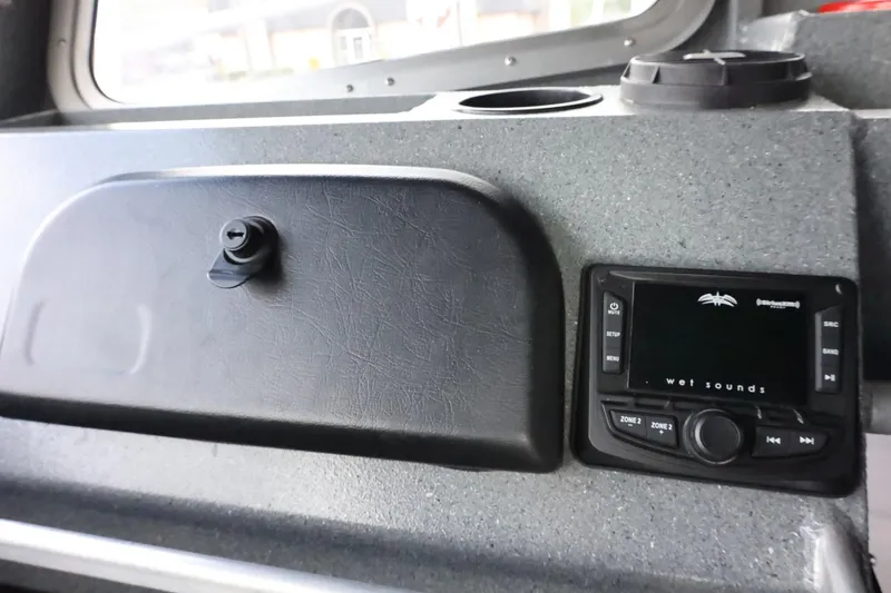 Slide: The Image of Control panel of a 2015 Duckworth 26 Offshore boat with audio system. - 45