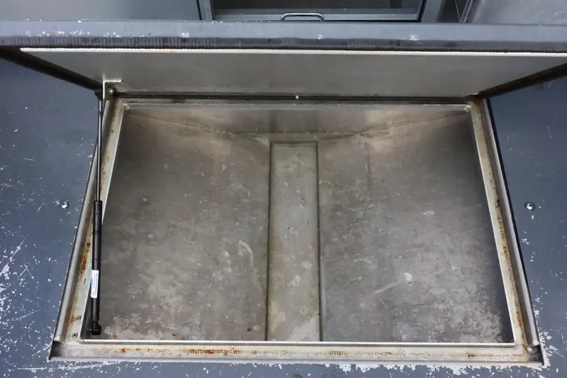 Slide: The Image of Open storage compartment on a 2015 Duckworth 26 Offshore boat. - 46