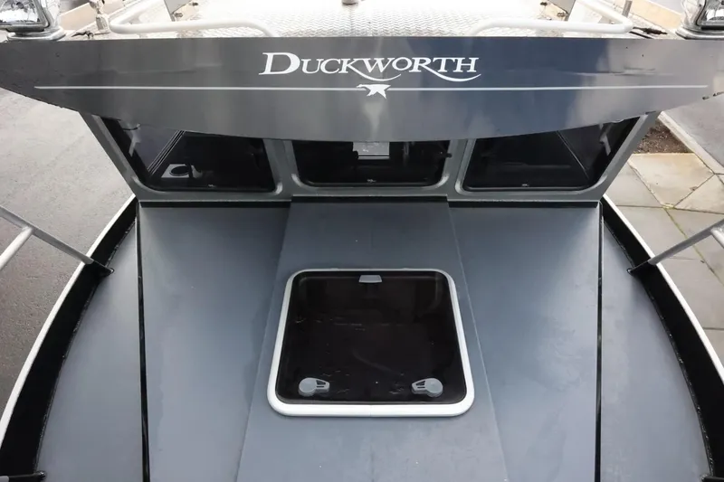 Slide: The Image of 2015 Duckworth 26 Offshore boat deck with hatch and logo. - 48