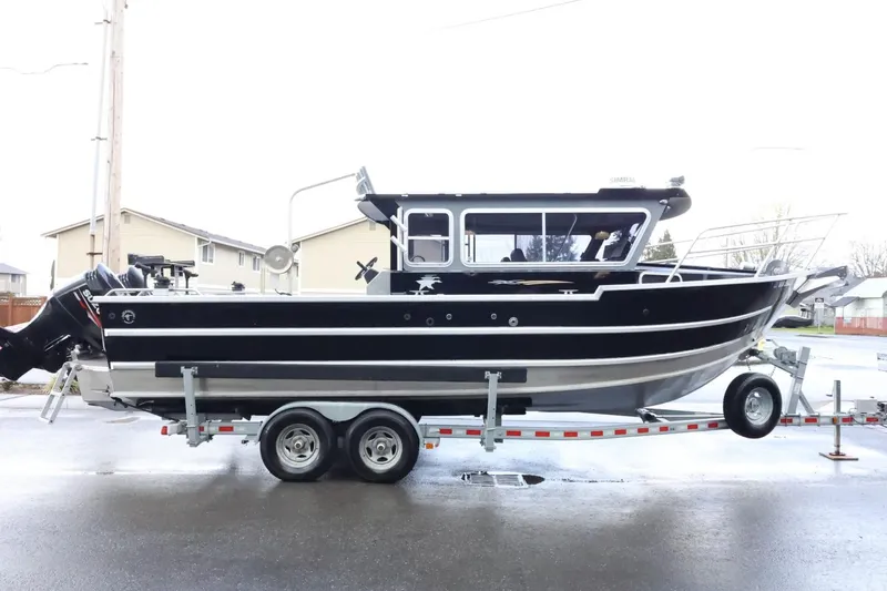 Slide: The Image of 2015 Duckworth 26 Offshore boat on trailer, side view, black and silver design. - 6