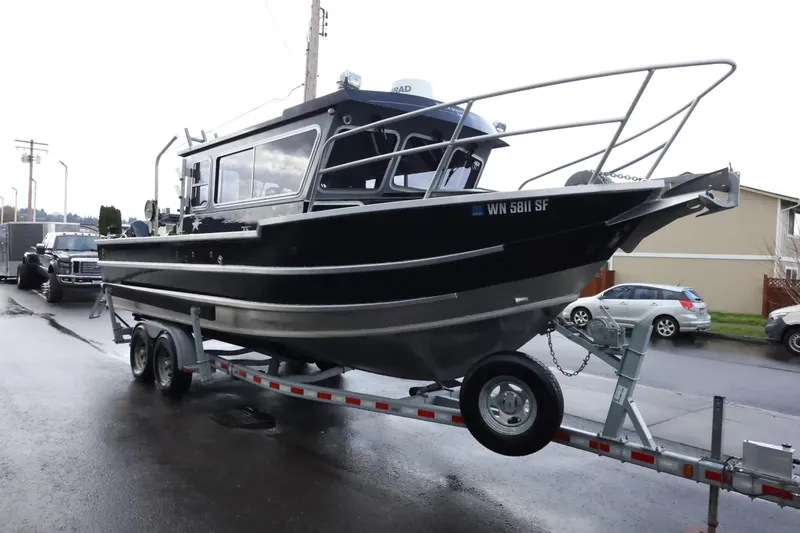 Slide: The Image of 2015 Duckworth 26 Offshore boat on trailer, parked on street. - 7