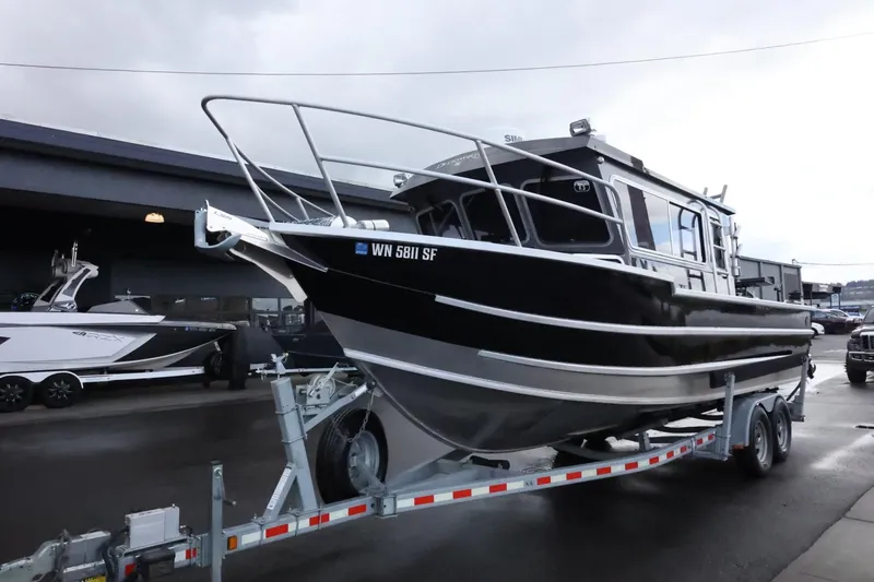 Slide: The Image of 2015 Duckworth 26 Offshore boat on trailer, parked outdoors. - 9