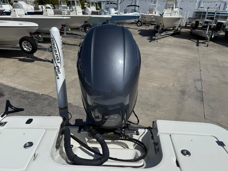 Slide: The Image of 2003 Action Craft 1820 boat engine and Power-Pole in a marina setting. - 7