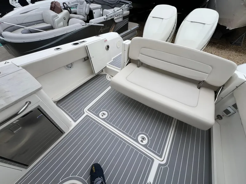 Slide: The Image of 2018 Boston Whaler 270 Vantage boat interior with seating and dual engines. - 15