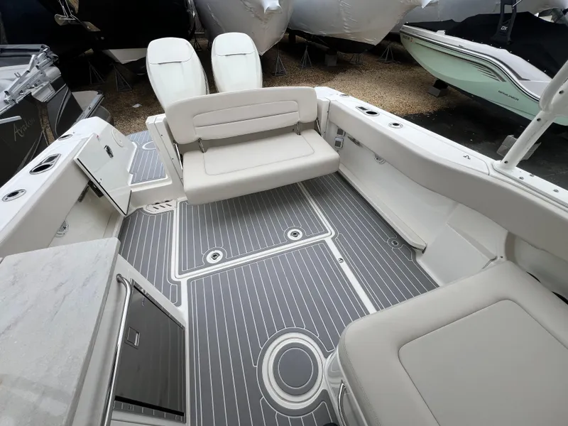 Slide: The Image of 2018 Boston Whaler 270 Vantage boat interior with seating and sleek flooring. - 16