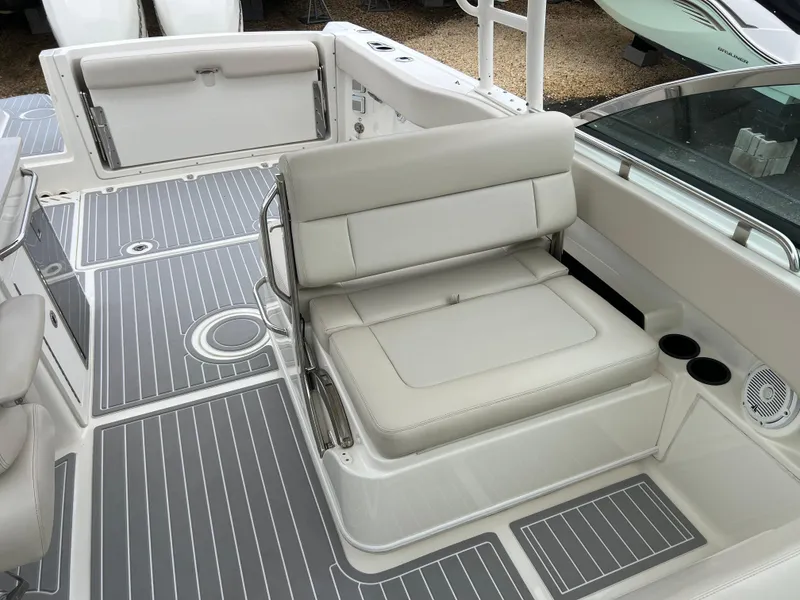 Slide: The Image of 2018 Boston Whaler 270 Vantage boat interior with cushioned seating and sleek design. - 26