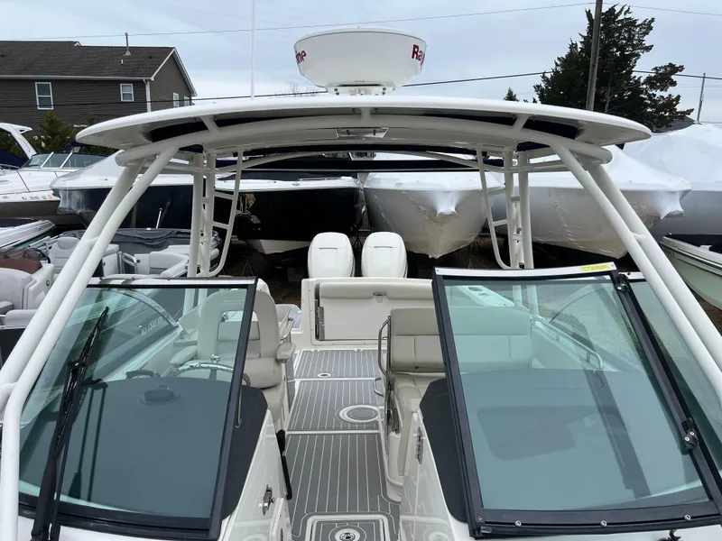 Slide: The Image of 2018 Boston Whaler 270 Vantage boat with open cockpit and dual consoles. - 31