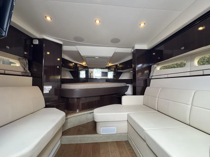 Slide: The Image of 2019 Sea Ray Sundancer 350 Coupe interior with elegant seating and modern design. - 10