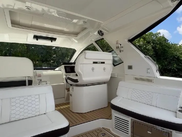 Slide: The Image of Interior of 2019 Sea Ray Sundancer 350 Coupe, featuring luxurious seating and modern design. - 3