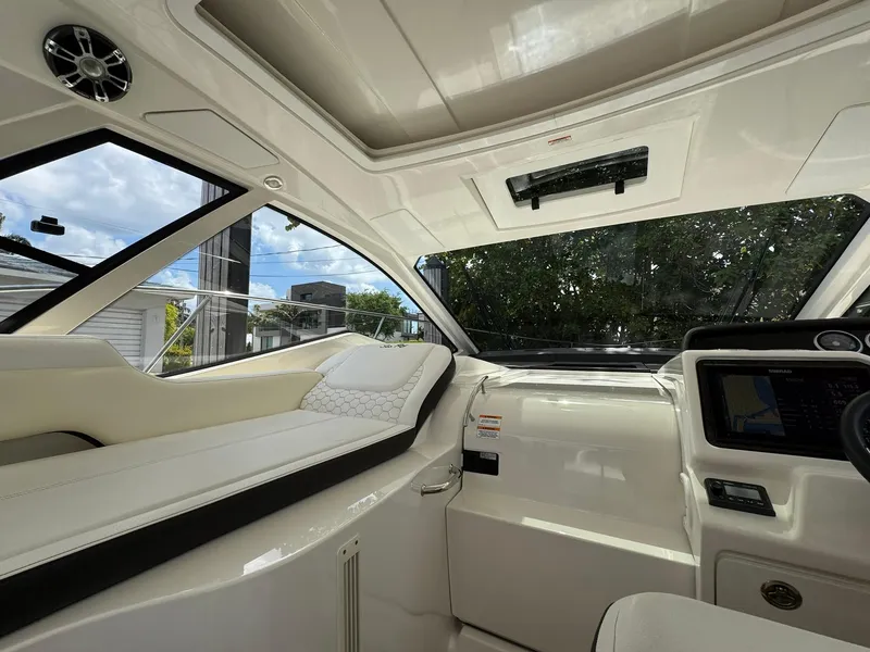 Slide: The Image of 2019 Sea Ray Sundancer 350 Coupe interior with sleek design and modern dashboard. - 6