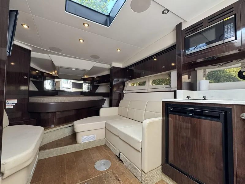 Slide: The Image of Luxurious interior of 2019 Sea Ray Sundancer 350 Coupe with modern amenities and elegant design. - 8