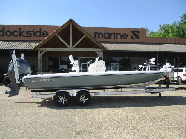 The Image of 2025 Skeeter SX241 boat on trailer outside Dockside Marine dealership. - 1