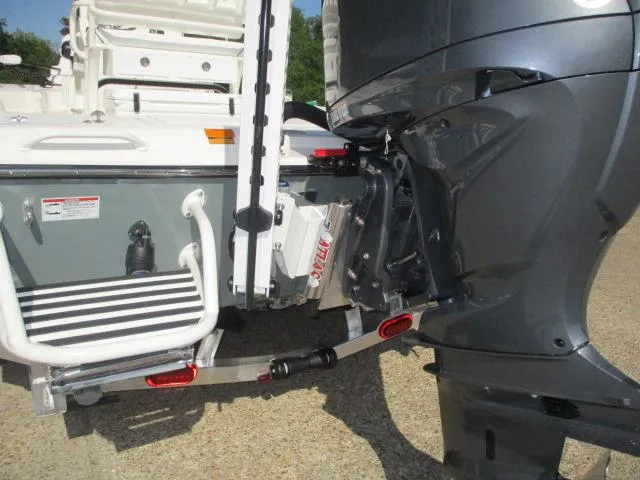 Slide: The Image of 2025 Skeeter SX241 boat with outboard motor and swim ladder, rear view. - 3