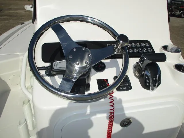 Slide: The Image of Steering console of 2025 Skeeter SX241 boat with chrome wheel and control panel. - 5