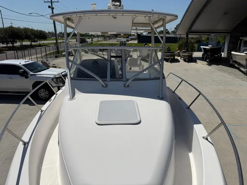 Slide: The Image of 2000 Pro-Line 27 Walk boat on display in a marina setting. - 16