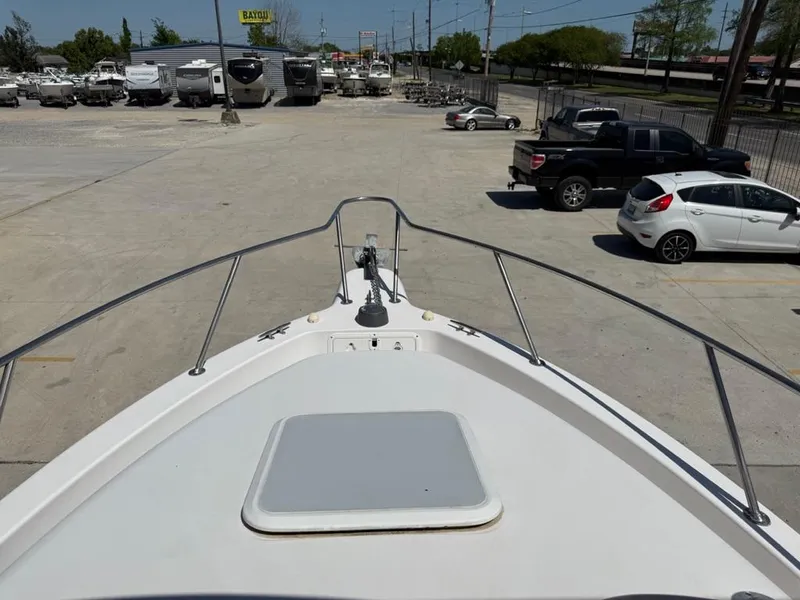 Slide: The Image of Bow view of 2000 Pro-Line 27 Walk boat in a parking lot. - 20