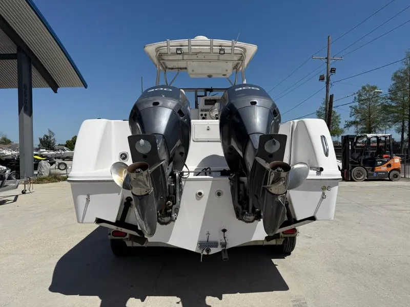 Slide: The Image of Rear view of 2000 Pro-Line 27 Walk boat with dual outboard motors. - 4