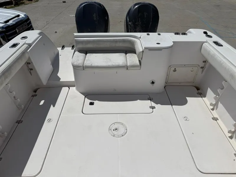 Slide: The Image of 2000 Pro-Line 27 Walk boat deck with seating and dual engines. - 9