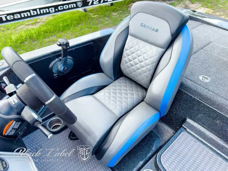 Slide: The Image of 2023 Caymas CX 20 PRO boat seat with quilted design and blue accents. - 14