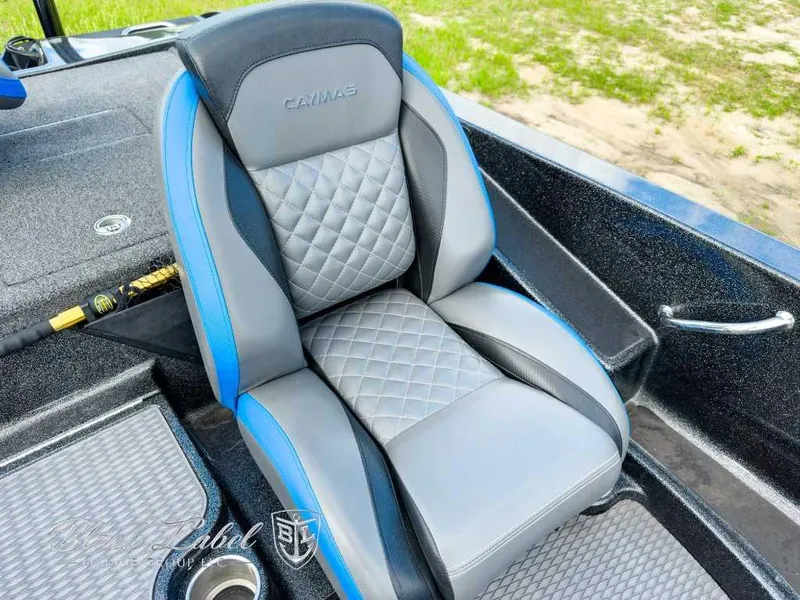 Slide: The Image of 2023 Caymas CX 20 PRO boat seat with quilted design and blue accents. - 19
