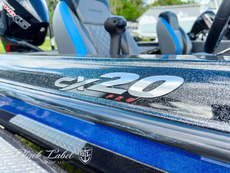 Slide: The Image of 2023 Caymas CX 20 PRO boat with sleek design and logo detail. - 4