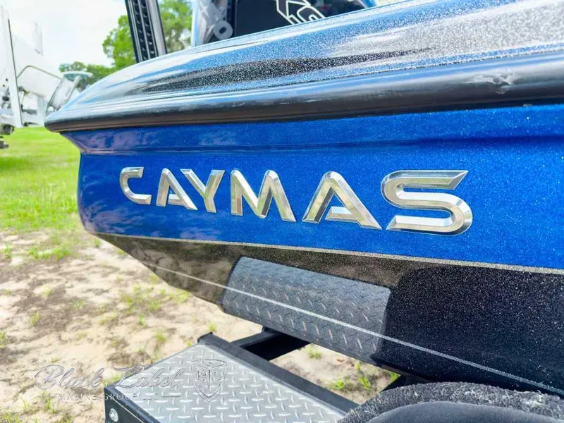 Slide: The Image of 2023 Caymas CX 20 PRO boat, blue exterior, close-up view of logo and trailer. - 5